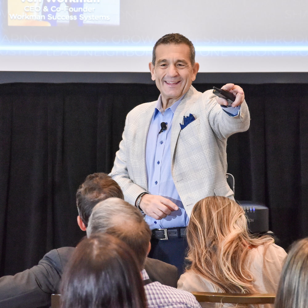 Verl Workman speaking at REMAX R4